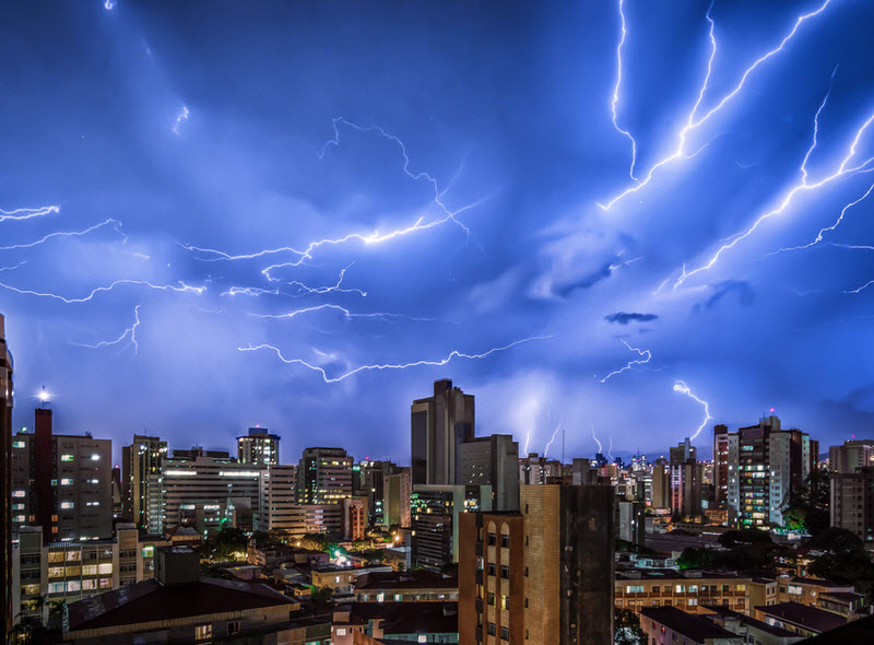 Thunder Storm with Various Lightnings Strikes In the Night Sky and Buildings